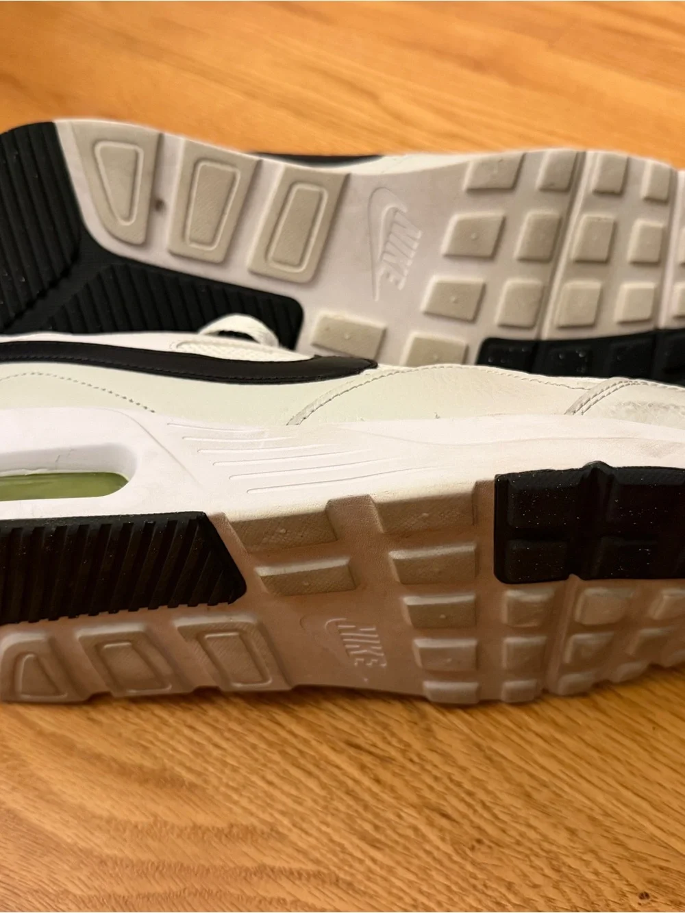 Nike Men's White Sneakers with Black Swoosh and Neon Yellow Accents